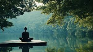 A person meditating peacefully outdoors